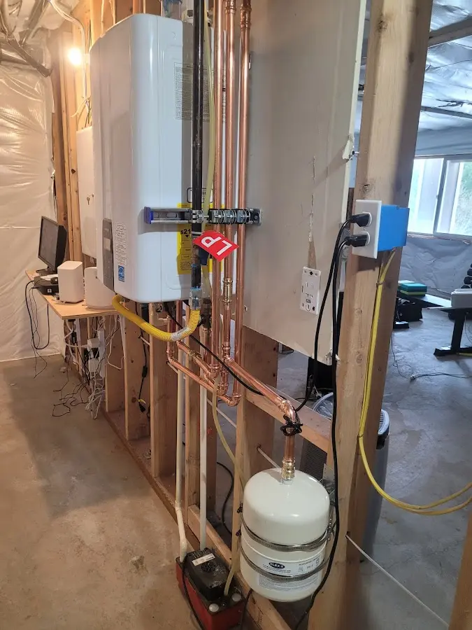 Licensed plumber repairing a kitchen sink in Oakland